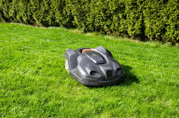 Robotic mower system being installed by Nardella’s Turf Care in Branford with discreet boundary wiring